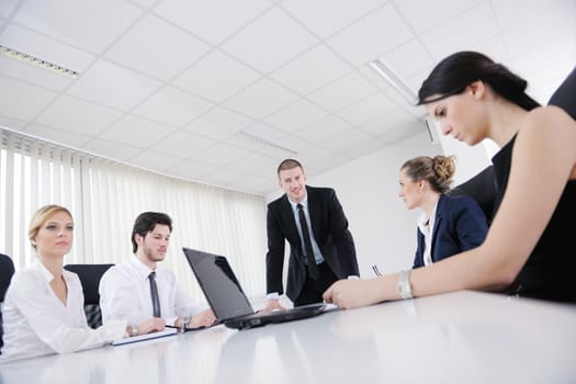 Group of happy young  business people in a meeting at office