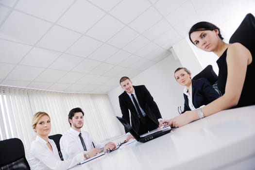 Group of happy young  business people in a meeting at office