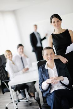 business woman  with her staff,  people group in background at modern bright office indoors