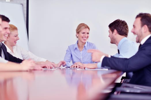 Group of happy young  business people in a meeting at office