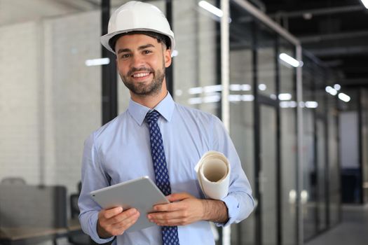 Shot of a engineer using a digital tablet on a construction site