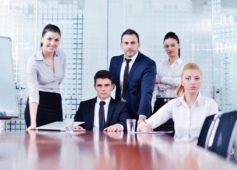 Group of happy young  business people in a meeting at office