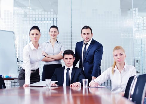 Group of happy young  business people in a meeting at office