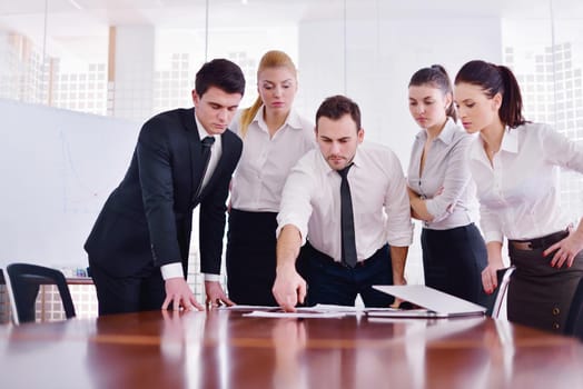 Group of happy young  business people in a meeting at office