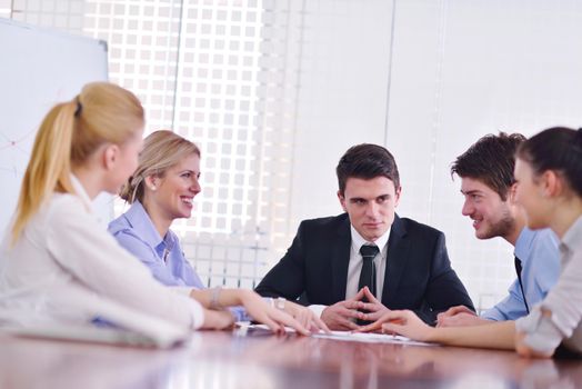 Group of happy young  business people in a meeting at office