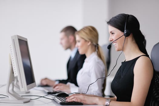 business people group with  headphones giving support in  help desk office to customers, manager giving training and education instructions