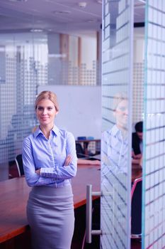 portrait of Young pretty business woman work on  notebook computer  in the bright modern office indoors