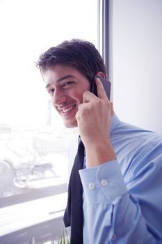 business man talking by cellphone in office