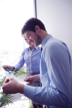 Group of happy young  business people in a meeting at office