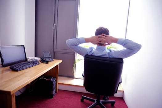 happy young business  man work in modern office on computer