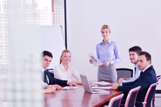 Group of happy young  business people in a meeting at office