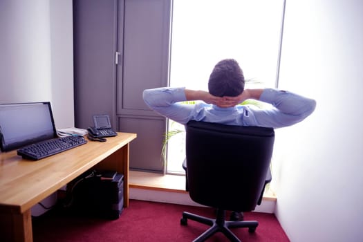 happy young business  man work in modern office on computer