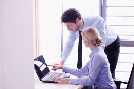 Group of happy young  business people in a meeting at office