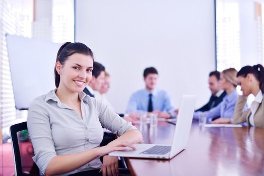 business woman  with her staff,  people group in background at modern bright office indoors