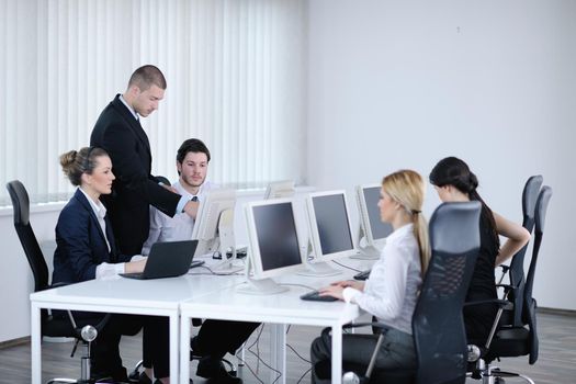 business people group with  headphones giving support in  help desk office to customers, manager giving training and education instructions