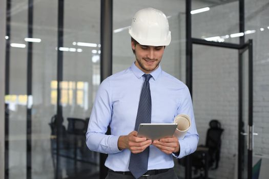 Shot of a engineer using a digital tablet on a construction site