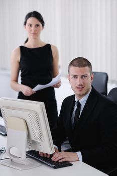 Group of happy young  business people in a meeting at office