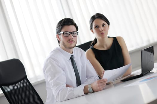 Group of happy young  business people in a meeting at office