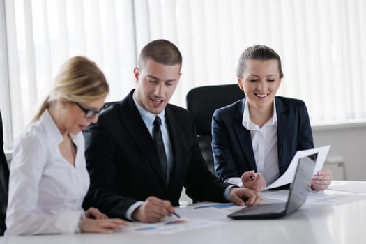 Group of happy young  business people in a meeting at office