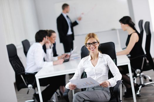 business woman  with her staff,  people group in background at modern bright office indoors