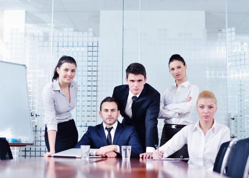 Group of happy young  business people in a meeting at office