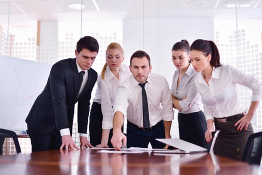 Group of happy young  business people in a meeting at office