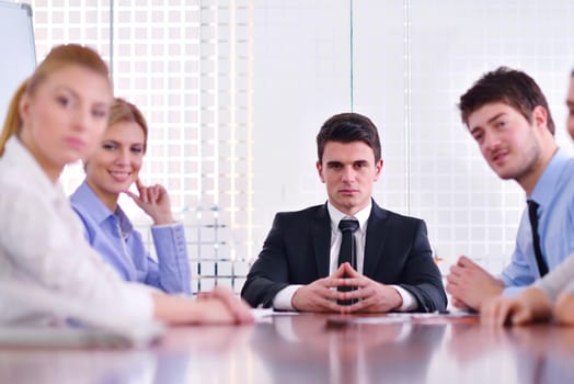 Group of happy young  business people in a meeting at office