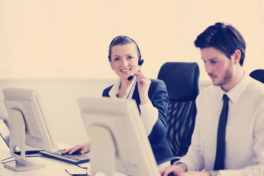 business people group with  headphones giving support in  help desk office to customers, manager giving training and education instructions