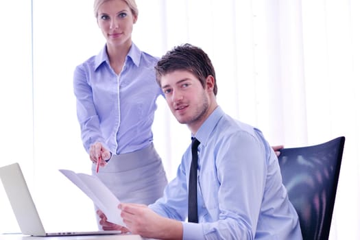 Group of happy young  business people in a meeting at office