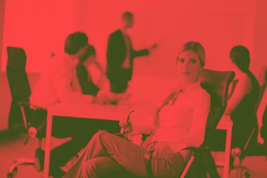 business woman  with her staff,  people group in background at modern bright office indoors