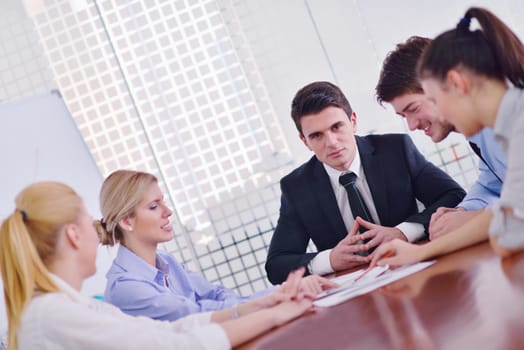 Group of happy young  business people in a meeting at office