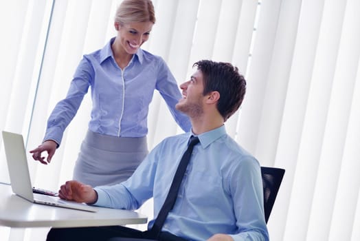 Group of happy young  business people in a meeting at office