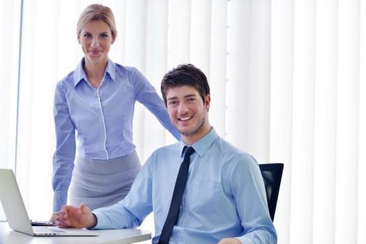 Group of happy young  business people in a meeting at office