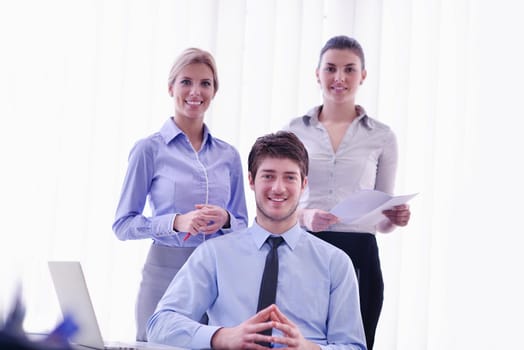 Group of happy young  business people in a meeting at office