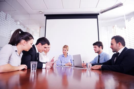 Group of happy young  business people in a meeting at office