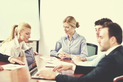 Group of happy young  business people in a meeting at office