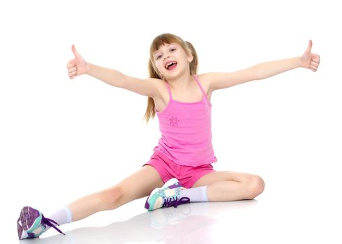 Little girl holding her thumb up. Concept Happy childhood, holiday, birthday.Isolated on white background