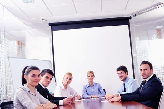 Group of happy young  business people in a meeting at office