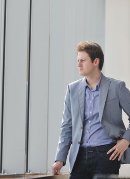 young business man lawyer with laptop alone in big bright   conference room