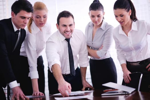 Group of happy young  business people in a meeting at office