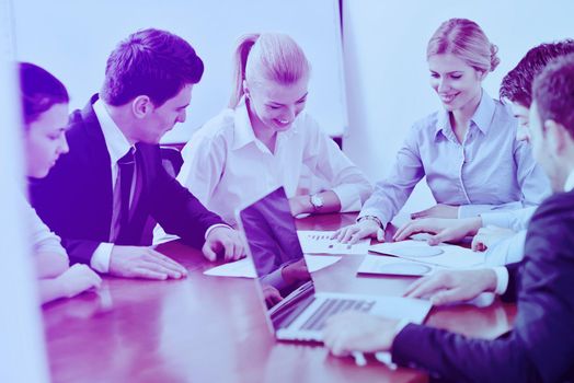 Group of happy young  business people in a meeting at office