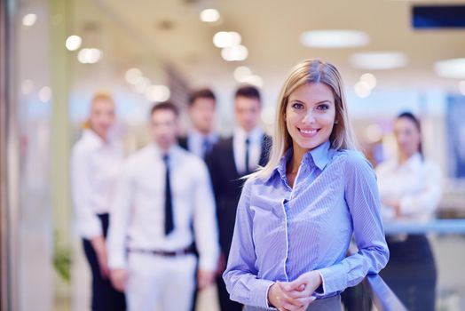 business woman  with her staff,  people group in background at modern bright office indoors