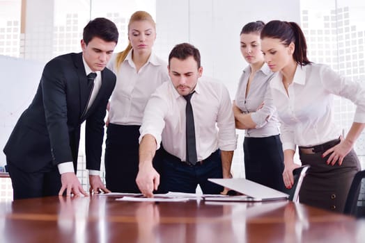 Group of happy young  business people in a meeting at office