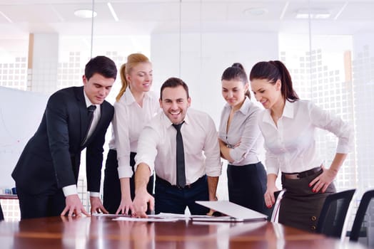 Group of happy young  business people in a meeting at office