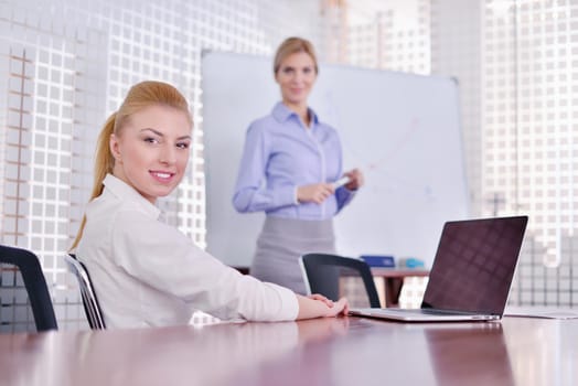 Group of happy young  business people in a meeting at office