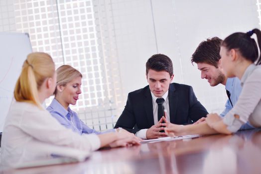 Group of happy young  business people in a meeting at office