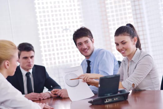 Group of happy young  business people in a meeting at office