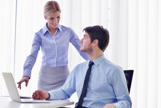 Group of happy young  business people in a meeting at office