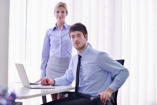 Group of happy young  business people in a meeting at office