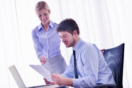 Group of happy young  business people in a meeting at office